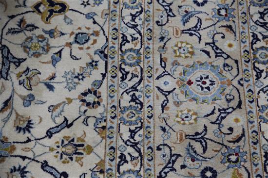 A Tabriz cream ground carpet, 12ft 6in. by 9ft 9in.